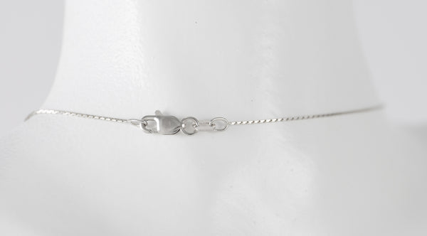 Cadena con colgante en oro blanco 18k y brillantes