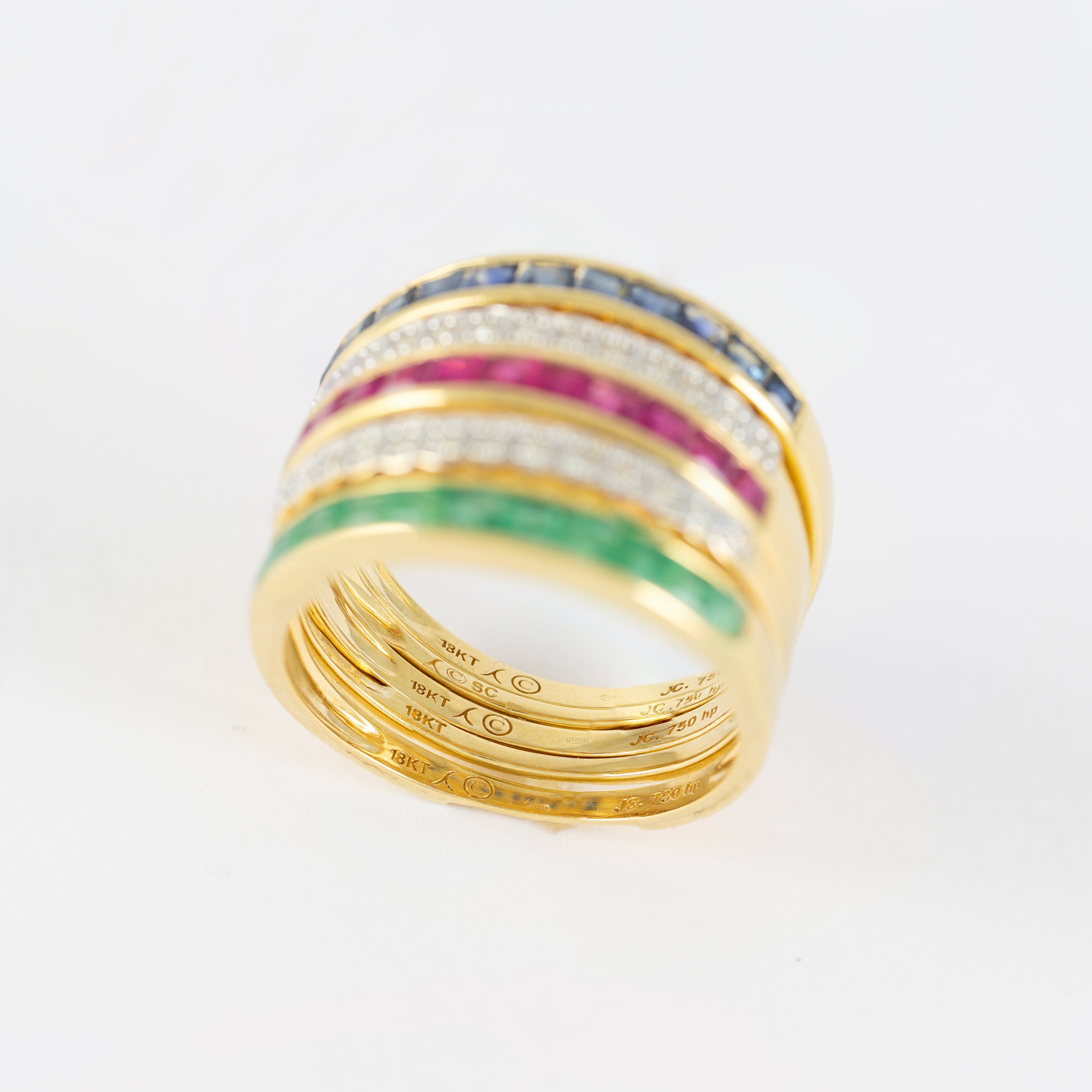 Anillo Infinity en oro amarillo 18k con diamantes zafiros rubíes y esmeraldas