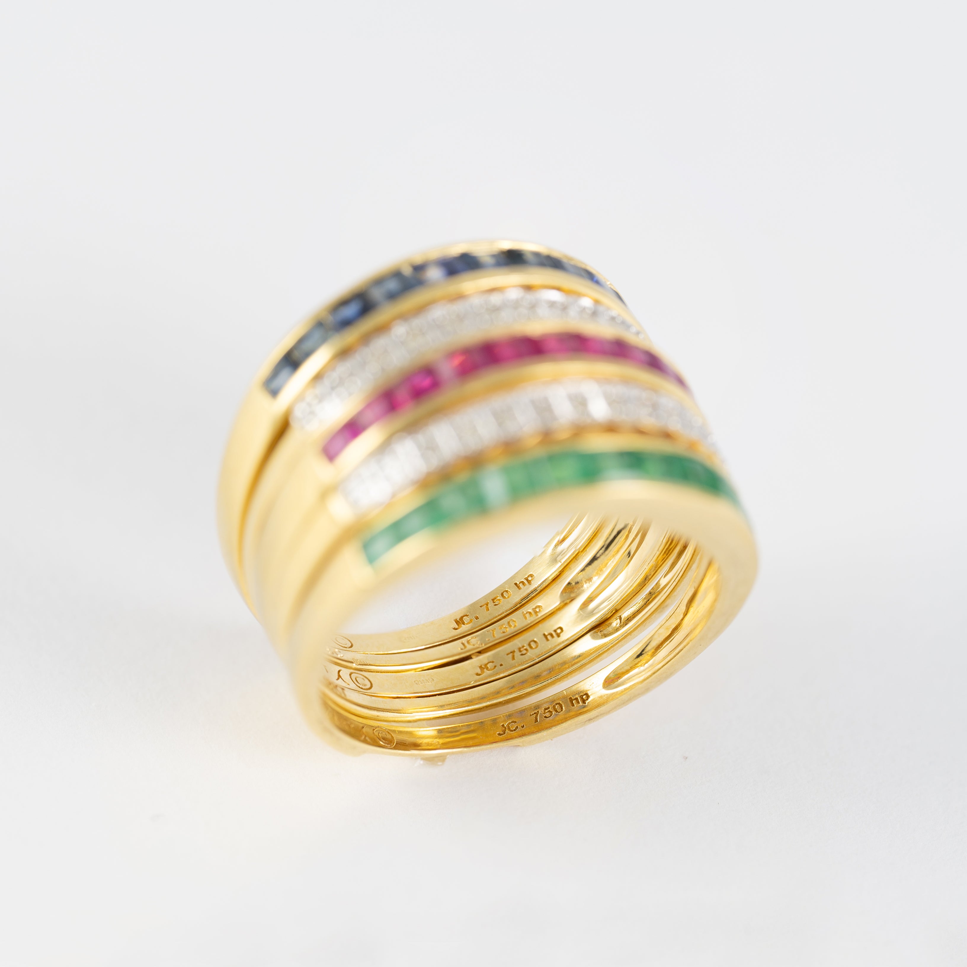 Anillo Infinity en oro amarillo 18k con diamantes zafiros rubíes y esmeraldas