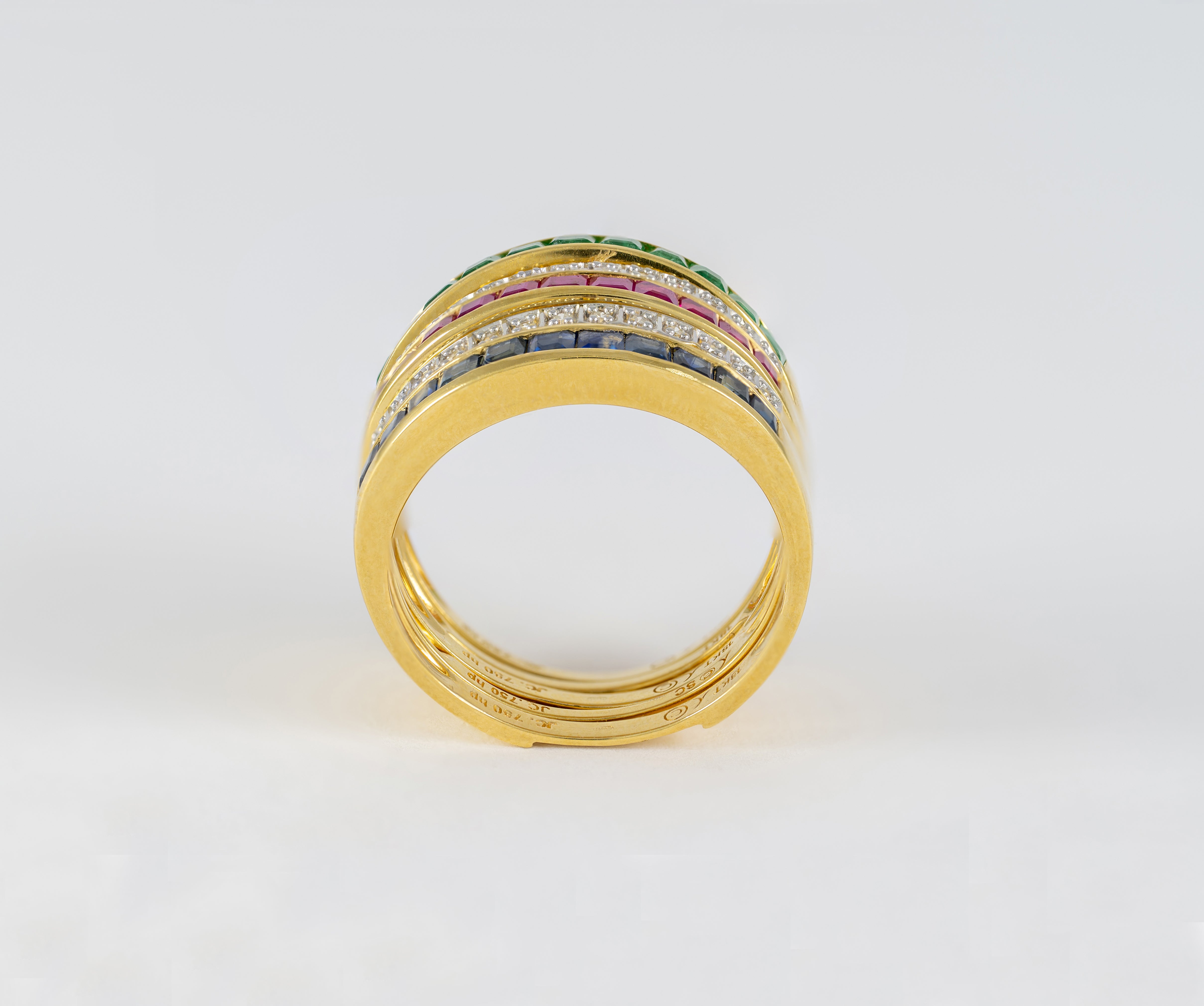 Anillo Infinity en oro amarillo 18k con diamantes zafiros rubíes y esmeraldas