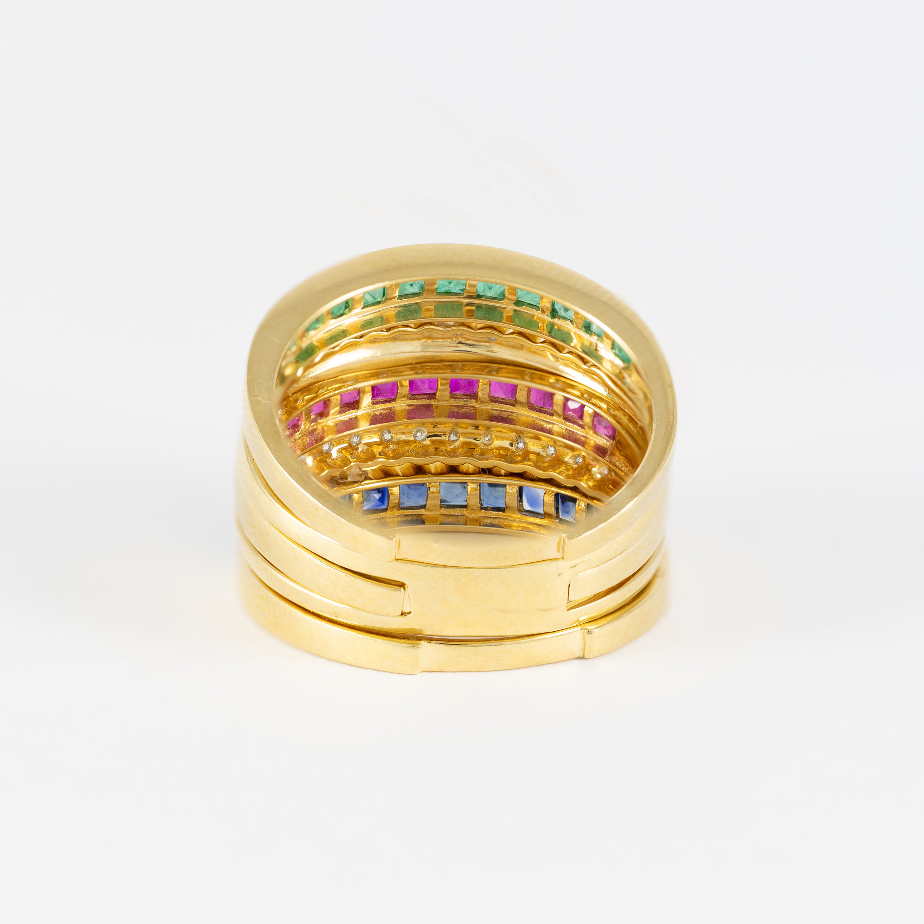 Anillo Infinity en oro amarillo 18k con diamantes zafiros rubíes y esmeraldas