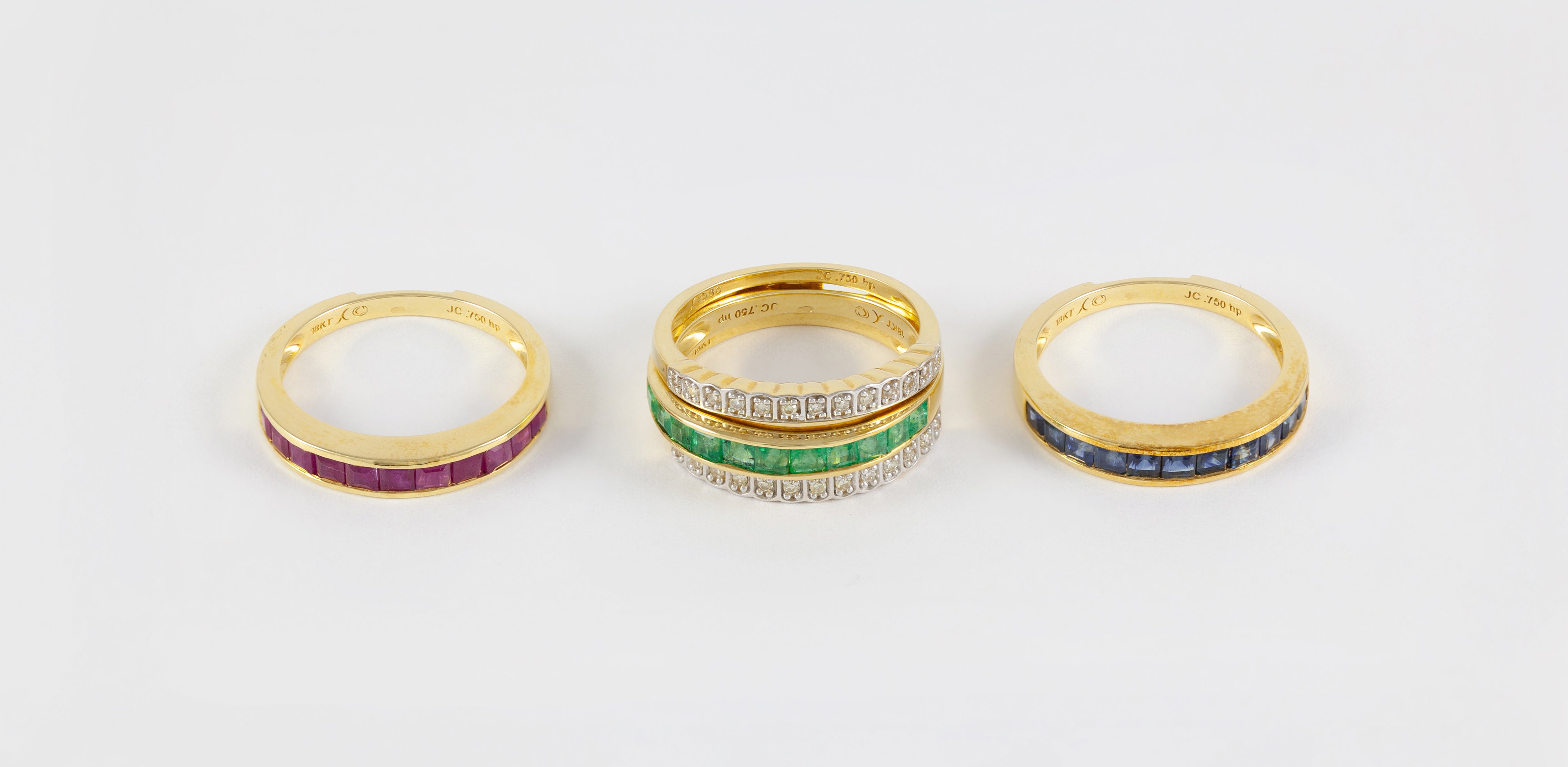 Anillo Infinity en oro amarillo 18k con diamantes zafiros rubíes y esmeraldas