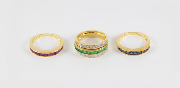 Anillo Infinity en oro amarillo 18k con diamantes zafiros rubíes y esmeraldas