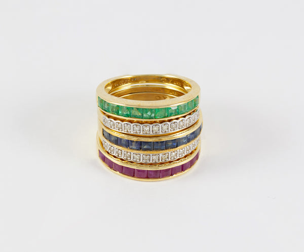 Anillo Infinity en oro amarillo 18k con diamantes zafiros rubíes y esmeraldas