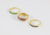 Anillo Infinity en oro amarillo 18k con diamantes zafiros rubíes y esmeraldas