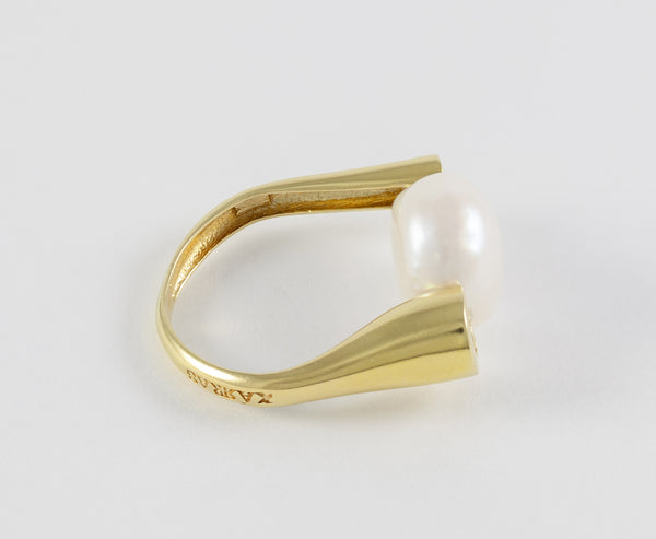 Anillo en oro amarillo 18k y perla