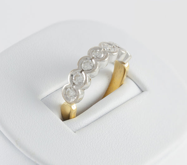 Anillo en oro blanco y amarillo 18k con brillantes