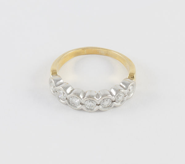 Anillo en oro blanco y amarillo 18k con brillantes