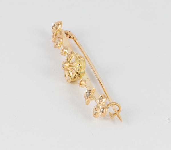 Broche antiguo en oro amarillo 18k y brillantes