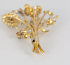 Broche antiguo en oro amarillo 18k con brillantes, amatistas y esmeraldas