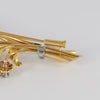 Broche antiguo en oro amarillo 18k con brillantes, amatistas y esmeraldas