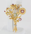 Broche antiguo en oro amarillo 18k con brillantes, amatistas y esmeraldas