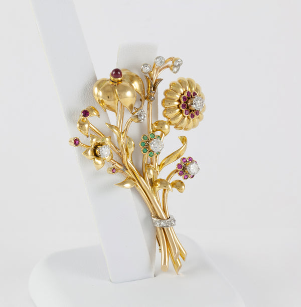 Broche antiguo en oro amarillo 18k con brillantes, amatistas y esmeraldas