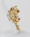 Broche antiguo en oro amarillo 18k con brillantes, amatistas y esmeraldas