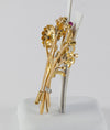 Broche antiguo en oro amarillo 18k con brillantes, amatistas y esmeraldas