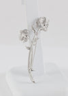 Broche flor en oro blanco 18k con brillantes