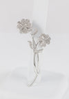 Broche flor en oro blanco 18k con brillantes