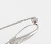 Broche en oro blanco 18k con brillantes y esmeraldas