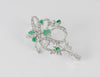 Broche antiguo en oro blanco 18k con esmeraldas y diamantes 1.34 ct