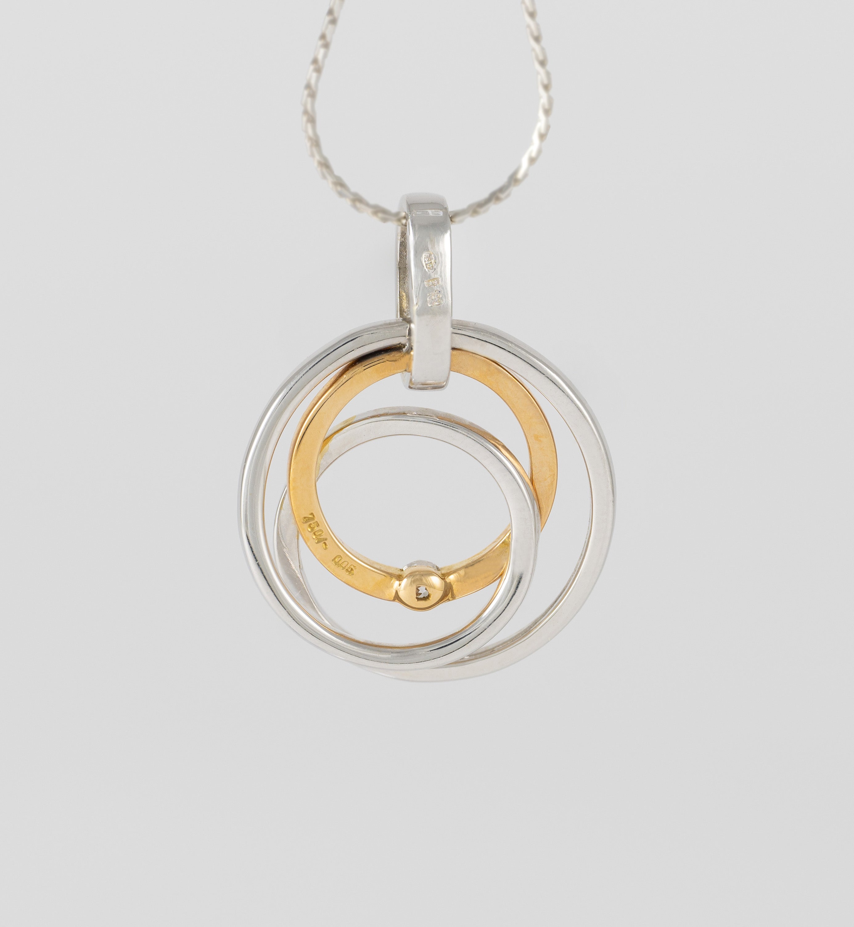 Colgante en oro amarillo y blanco 18k con brillante