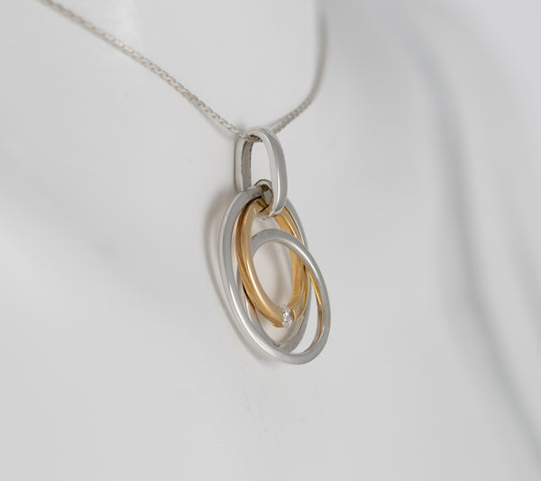 Colgante en oro amarillo y blanco 18k con brillante