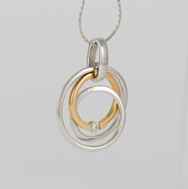 Colgante en oro amarillo y blanco 18k con brillante