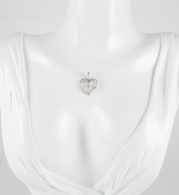 Colgante corazón en oro blanco 18k con brillante