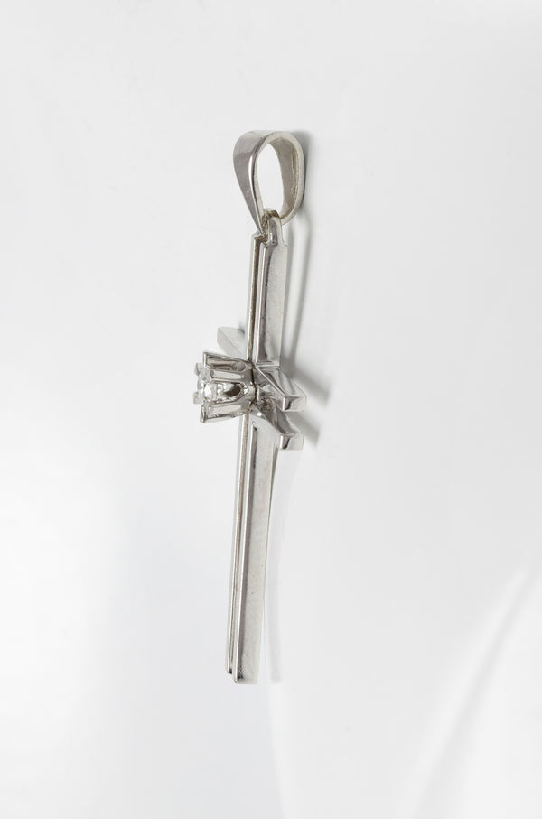 Colgante cruz en oro blanco 18k con brillante