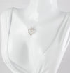 Colgante corazón en oro blanco 18k con brillante