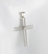 Colgante cruz en oro blanco 18k con brillante