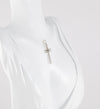 Colgante cruz en oro blanco 18k con brillante