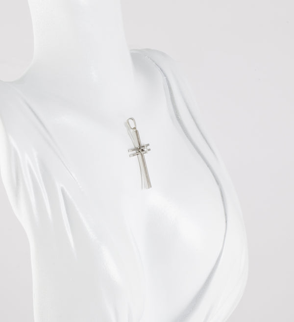 Colgante cruz en oro blanco 18k con brillante