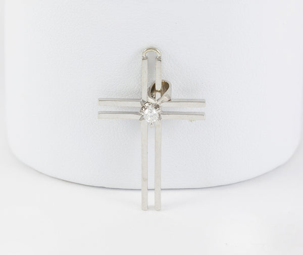 Colgante cruz en oro blanco 18k con brillante