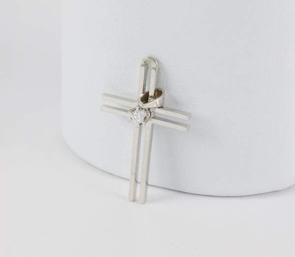Colgante cruz en oro blanco 18k con brillante