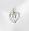 Colgante corazón en oro blanco 18k con brillante