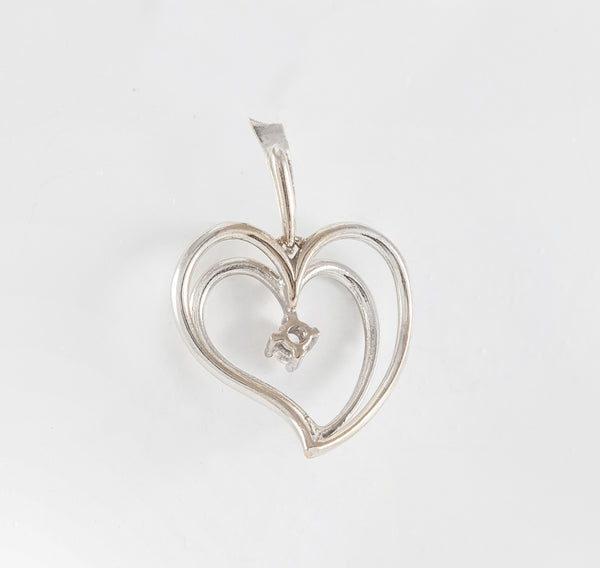 Colgante corazón en oro blanco 18k con brillante