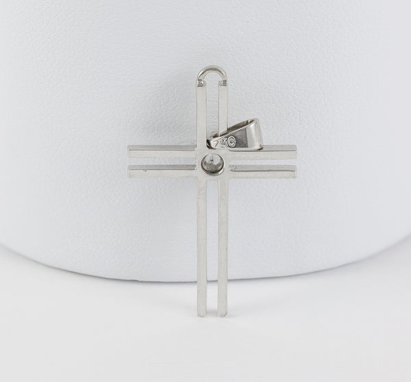 Colgante cruz en oro blanco 18k con brillante
