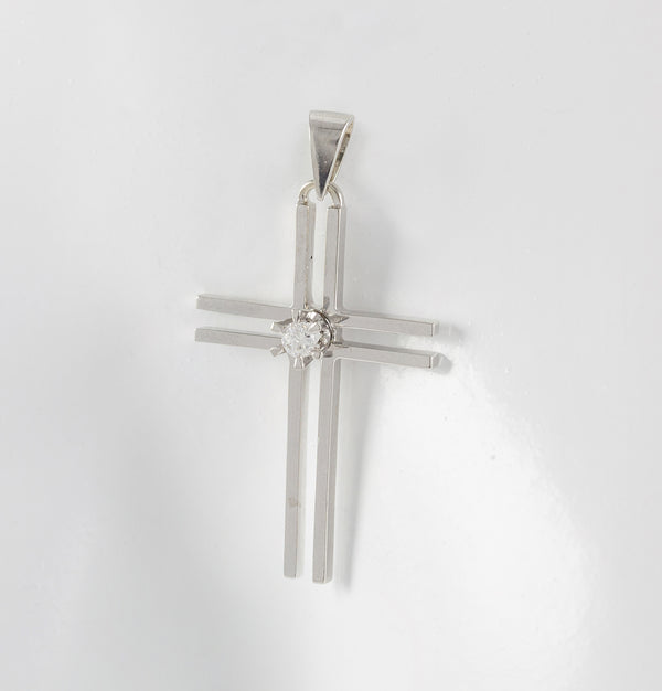 Colgante cruz en oro blanco 18k con brillante