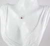 Colgante en oro blanco 18k con rubí y brillantes