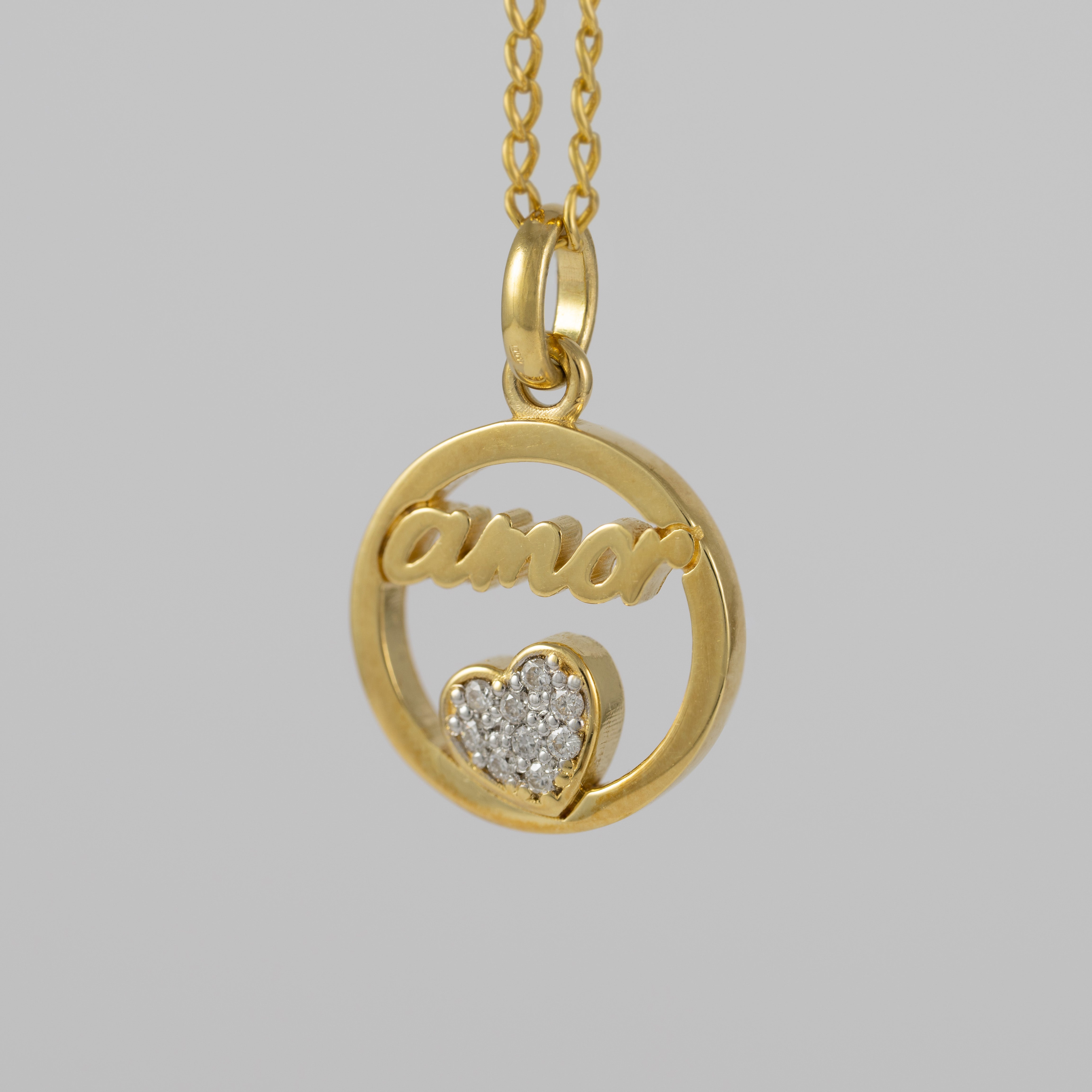 Colgante Tous Amor de oro amarillo 18k y diamantes Crossword