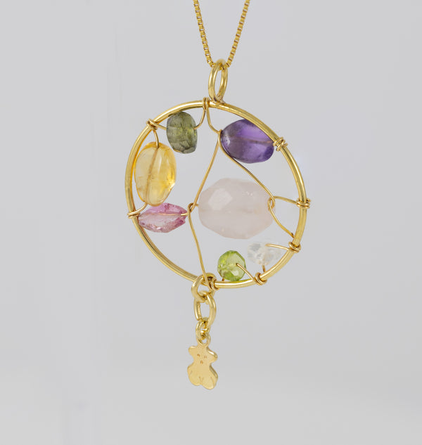 Colgante Tous en oro amarillo 18k y gemas Garabato