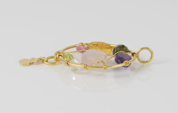 Colgante Tous en oro amarillo 18k y gemas Garabato