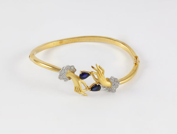 Conjunto Carrera y Carrera Pulsera y Anillo en oro amarillo y blanco 18k brillantes y zafiros