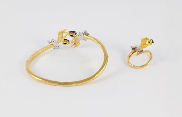 Conjunto Carrera y Carrera Pulsera y Anillo en oro amarillo y blanco 18k brillantes y zafiros