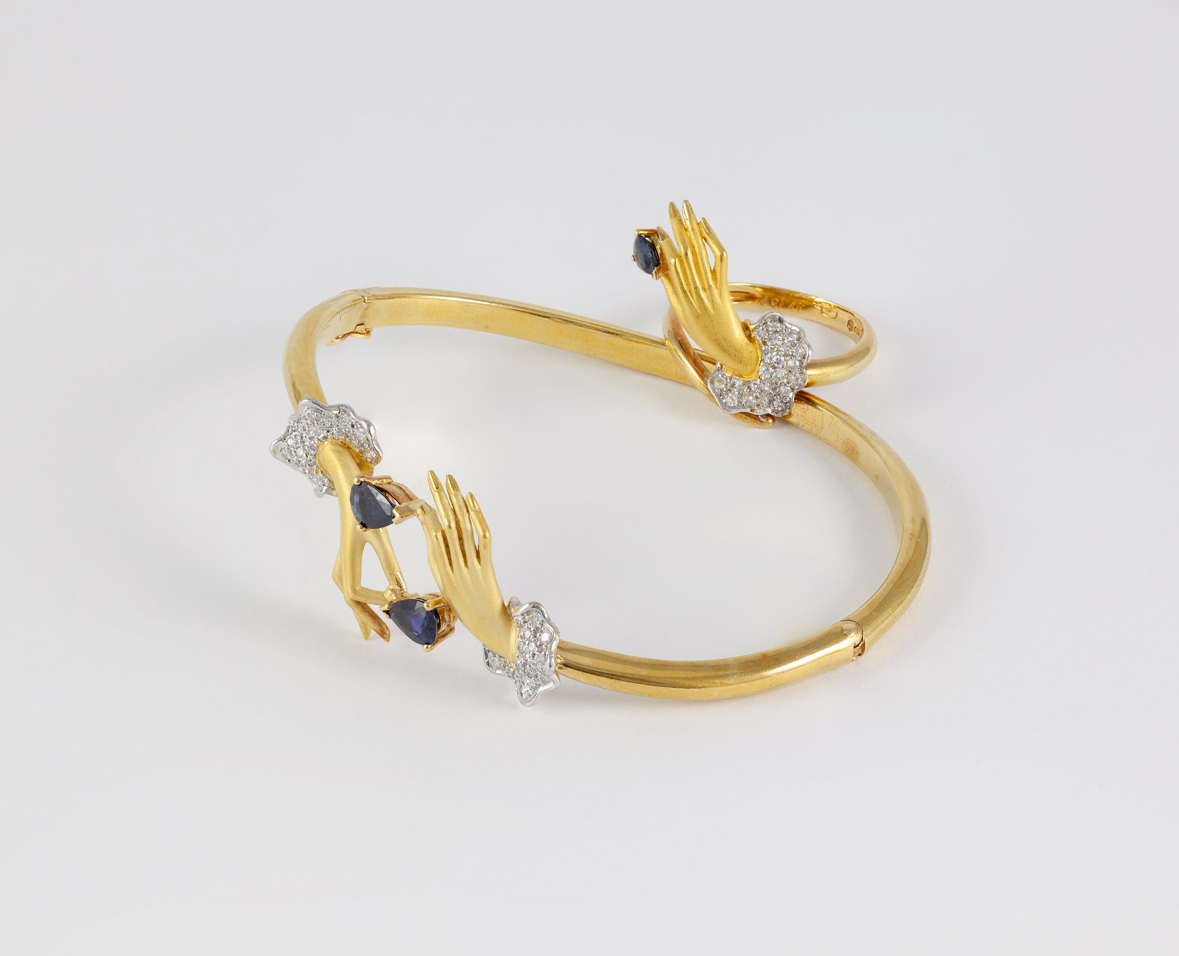 Conjunto Carrera y Carrera Pulsera y Anillo en oro amarillo y blanco 18k brillantes y zafiros