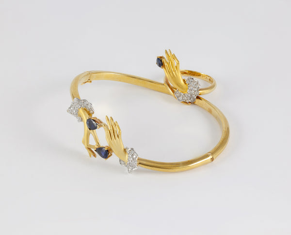 Conjunto Carrera y Carrera Pulsera y Anillo en oro amarillo y blanco 18k brillantes y zafiros