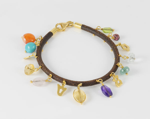 Pulsera Tous de cuero con motivos en oro amarillo 18k y gemas