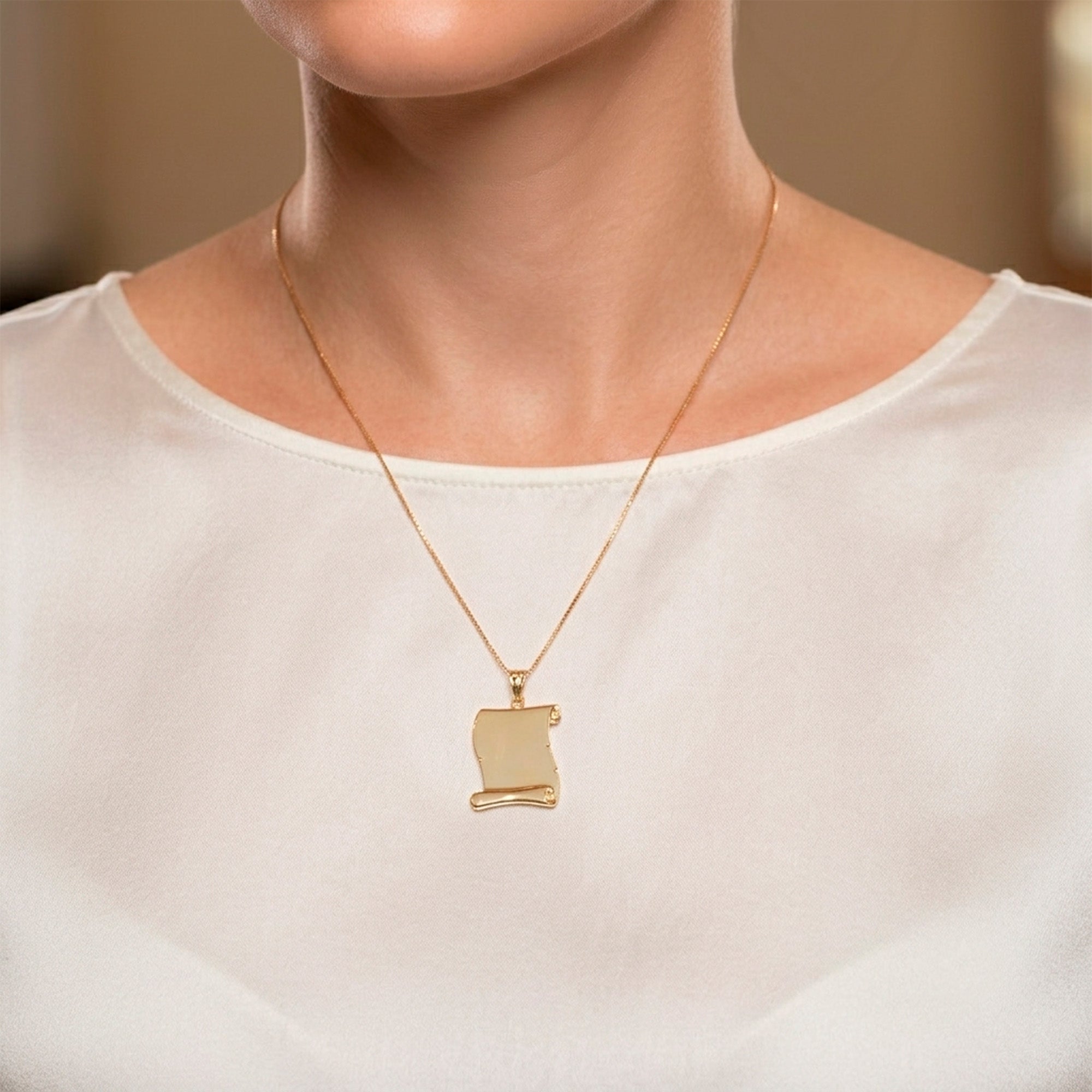 Colgante pergamino de oro 18k 750