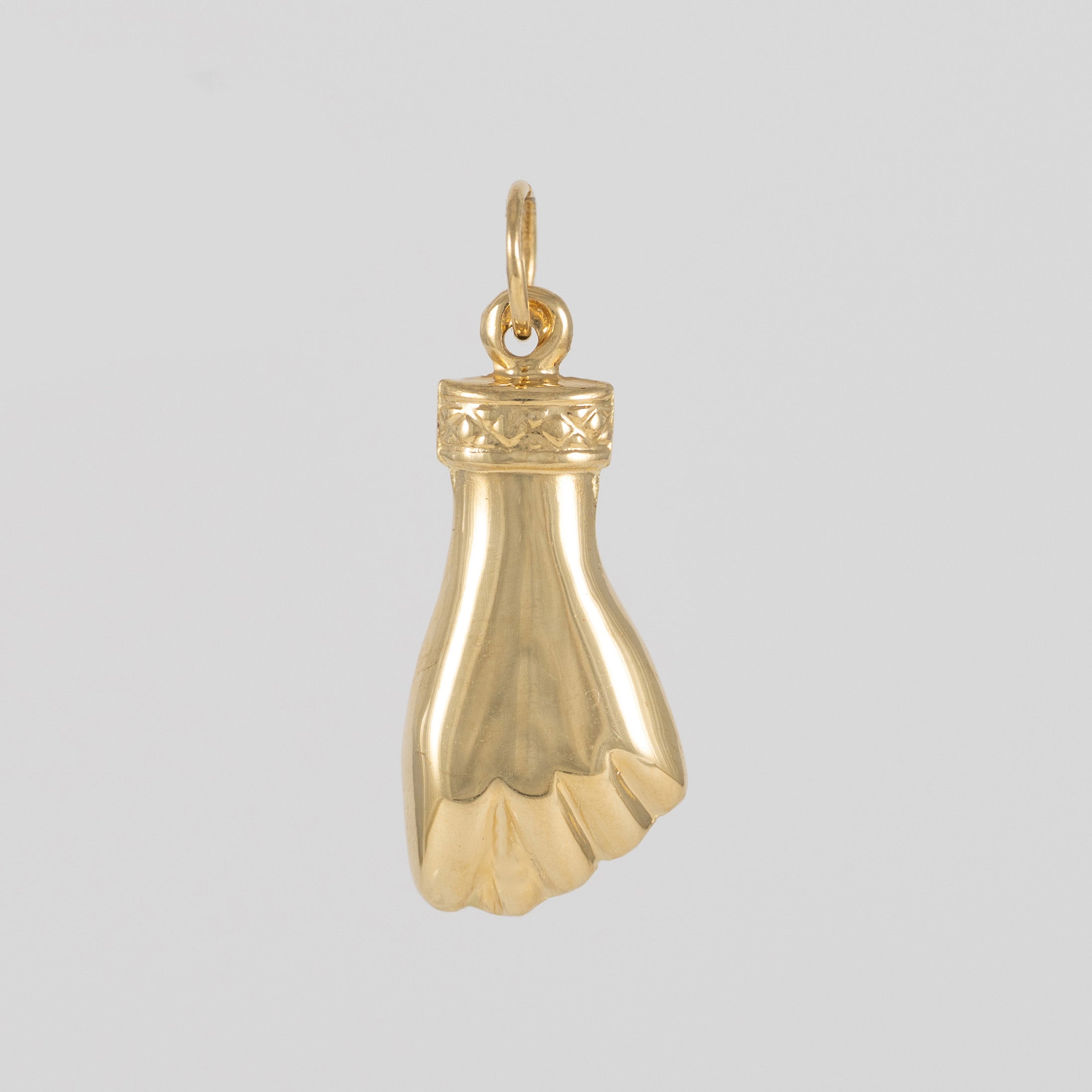 Colgante Puño oro 18k 750