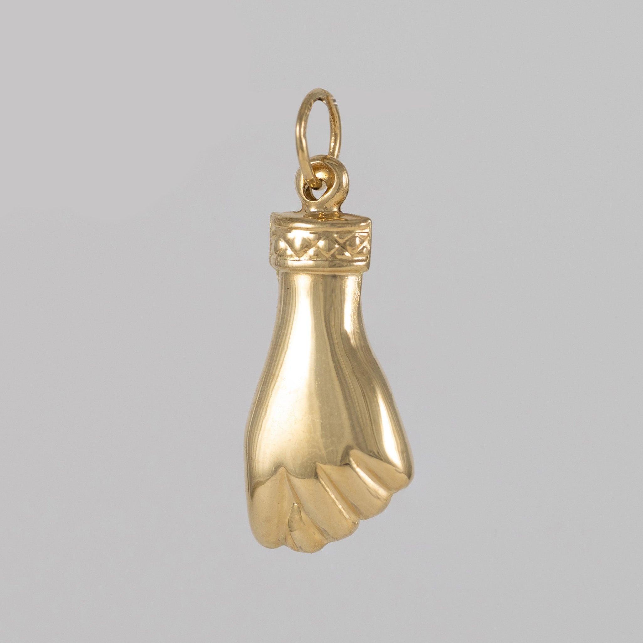 Colgante Puño oro 18k 750
